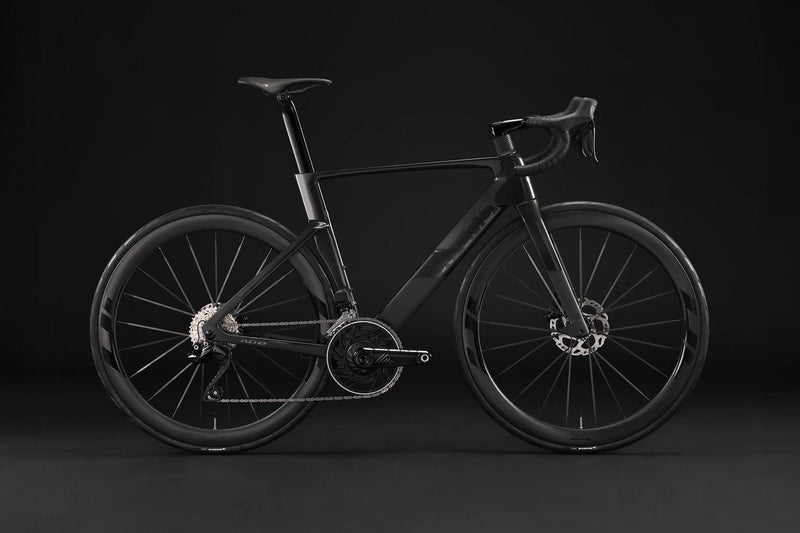 All black X-Lab AD8 in front of black back drop.