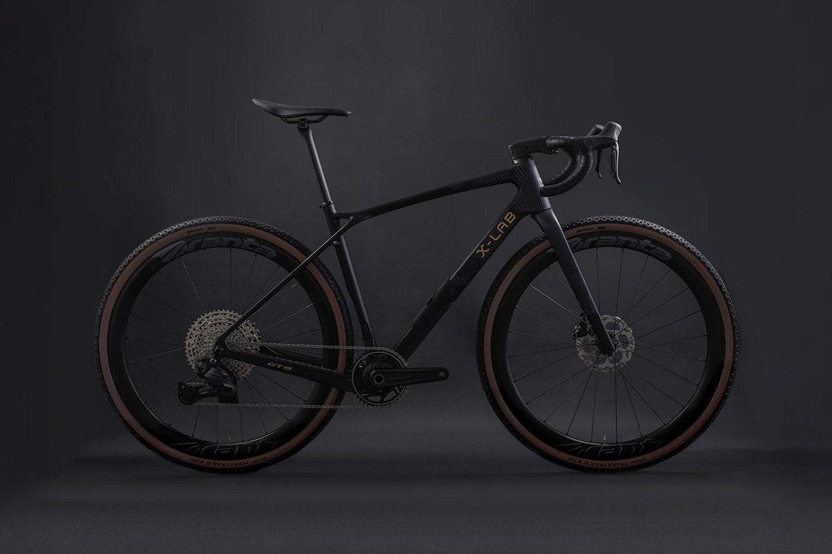 Black bicycle on a dark background