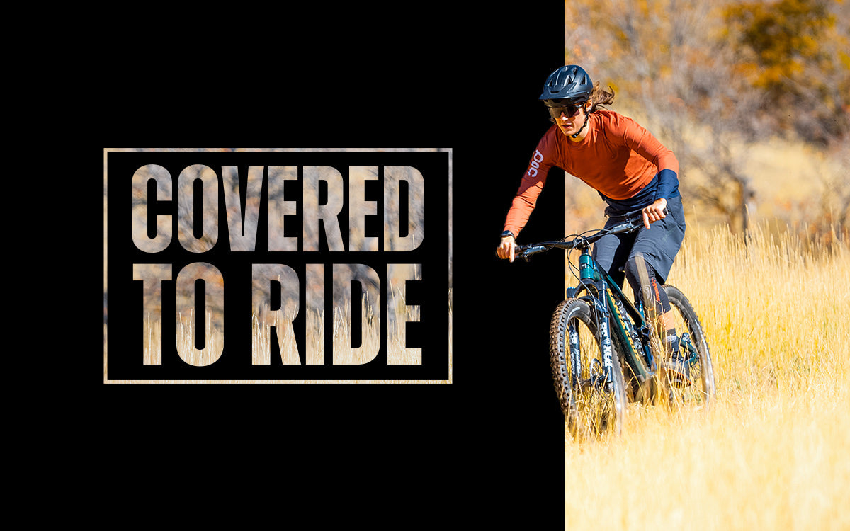 Text on the left states "Covered To Ride" with a mountain biker on the right.
