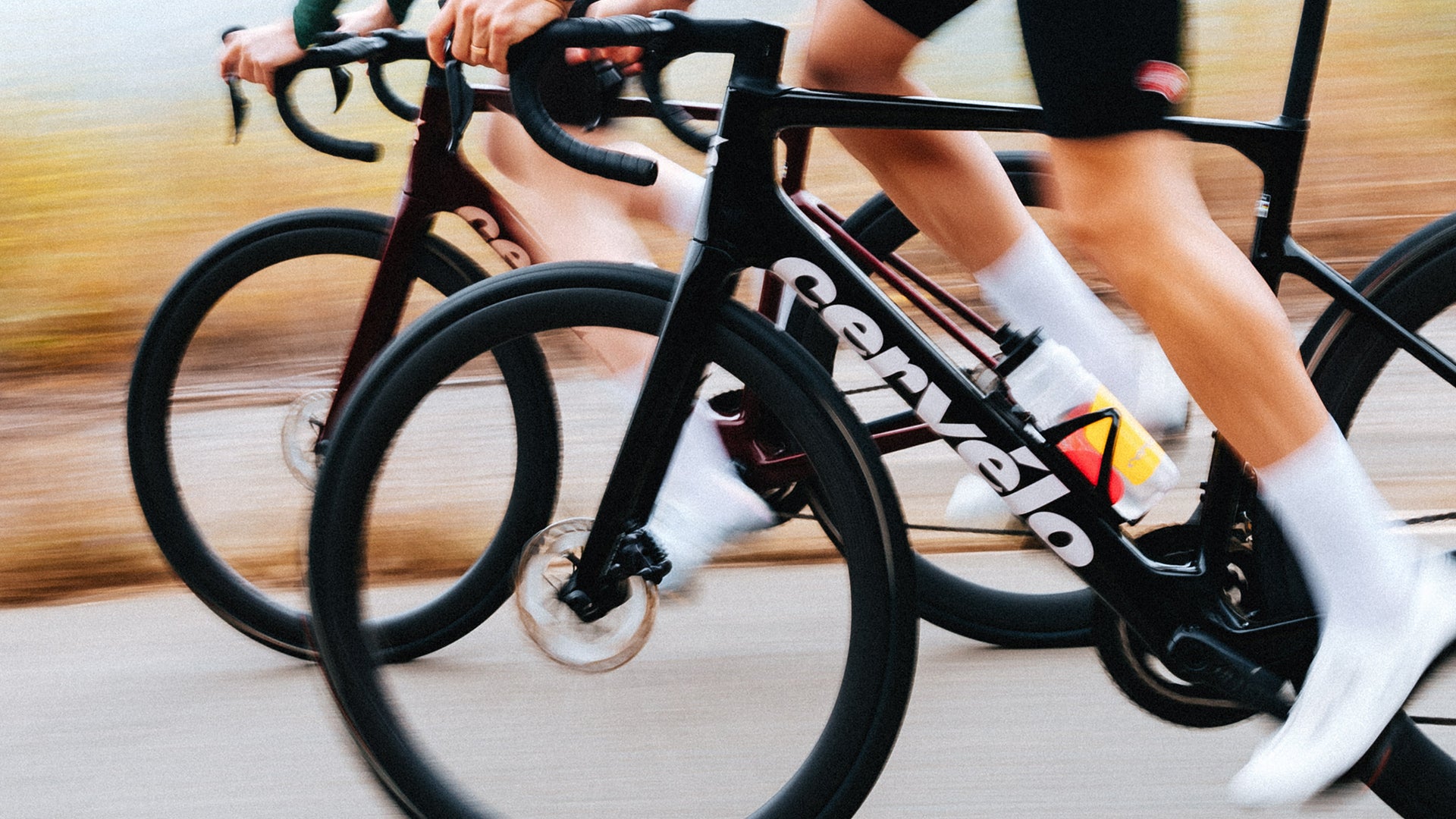 two people riding the cervelo caledonia road bike 