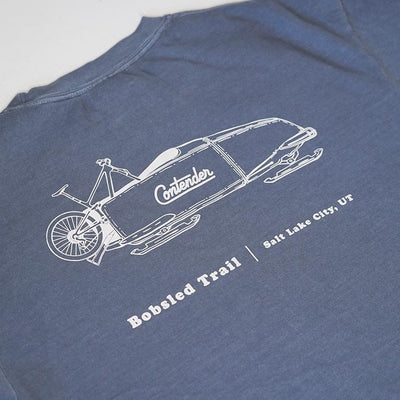 Close-up of the Contender Trail Series Bobsled T-shirt back graphic featuring a bike-equipped bobsled and Salt Lake City, Utah text.
