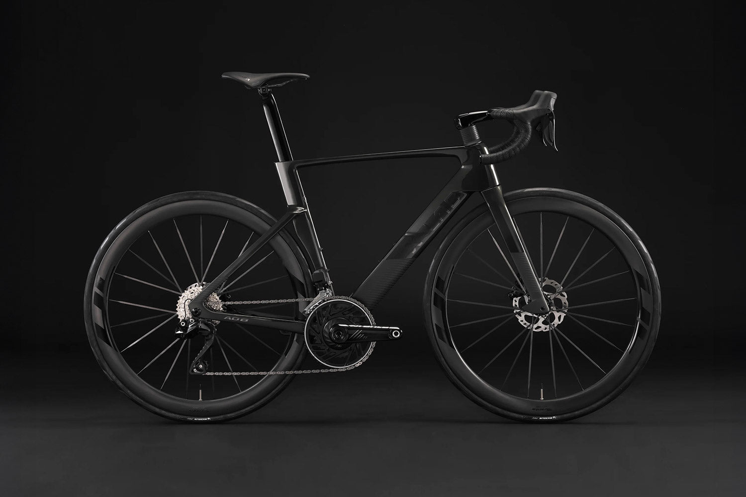 All black X-Lab AD8 in front of black back drop.