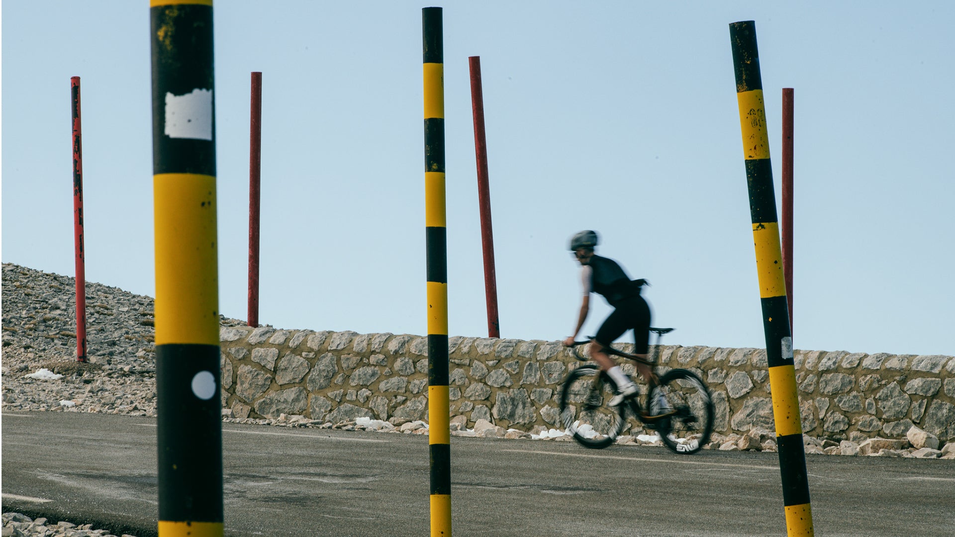 a man riding an enve melee road bike up a hill