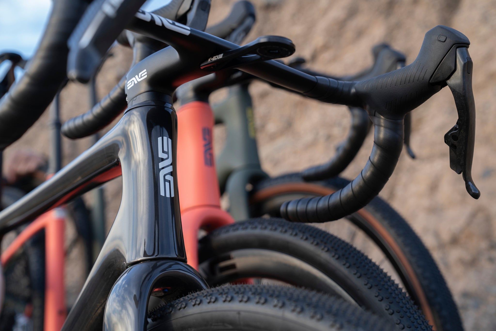 Three enve MOG gravel bikes photographed against a brick wall.