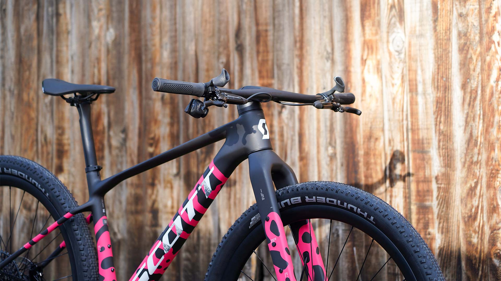 Scott Scale Gravel in front of wood fence.