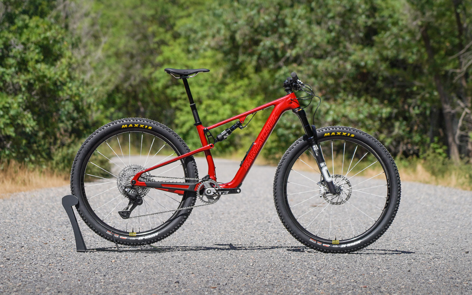 Red Santa Cruz Blur on a gravel road.