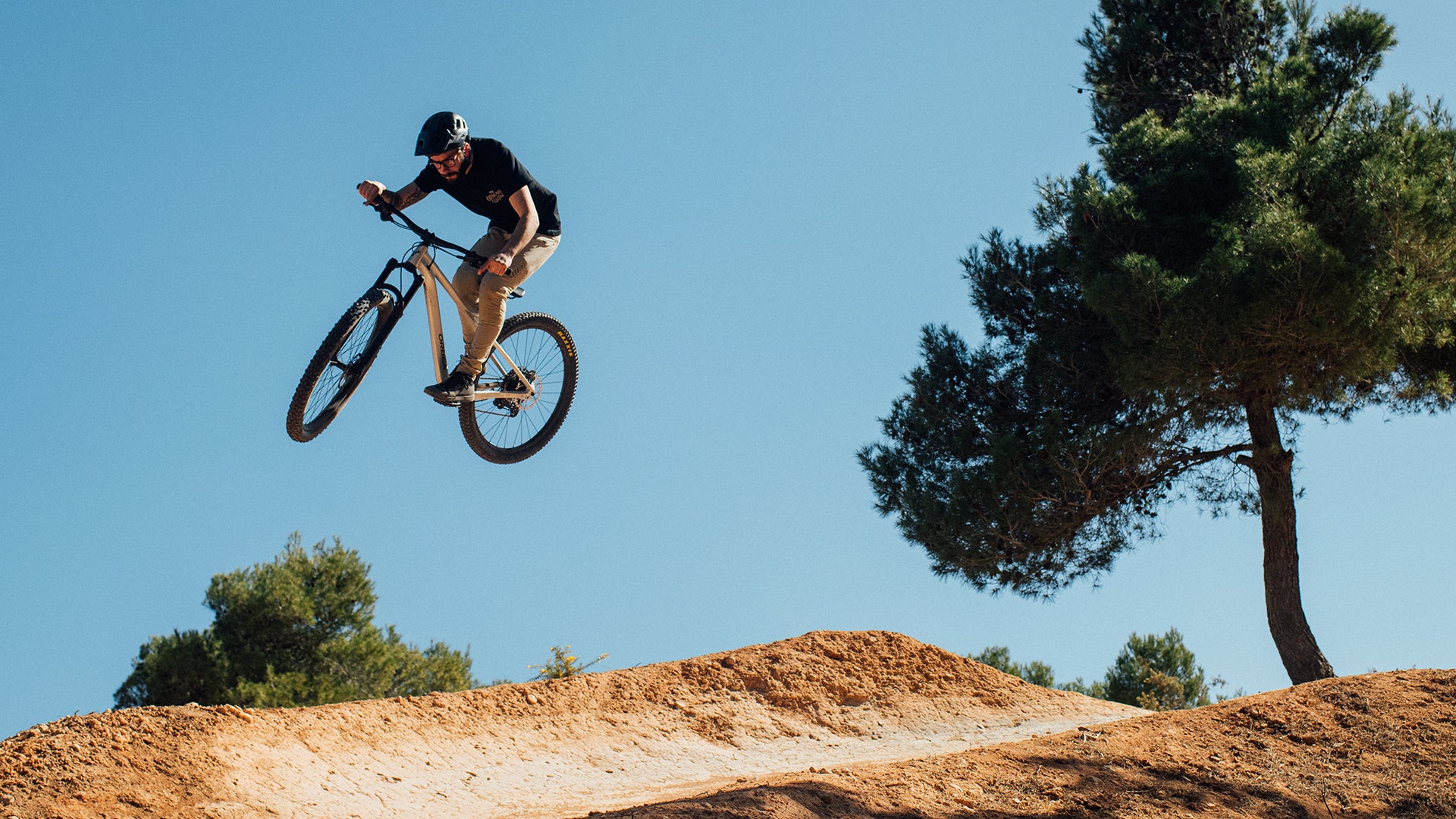 A man riding the Orbea Laufey Hardtail trail bike