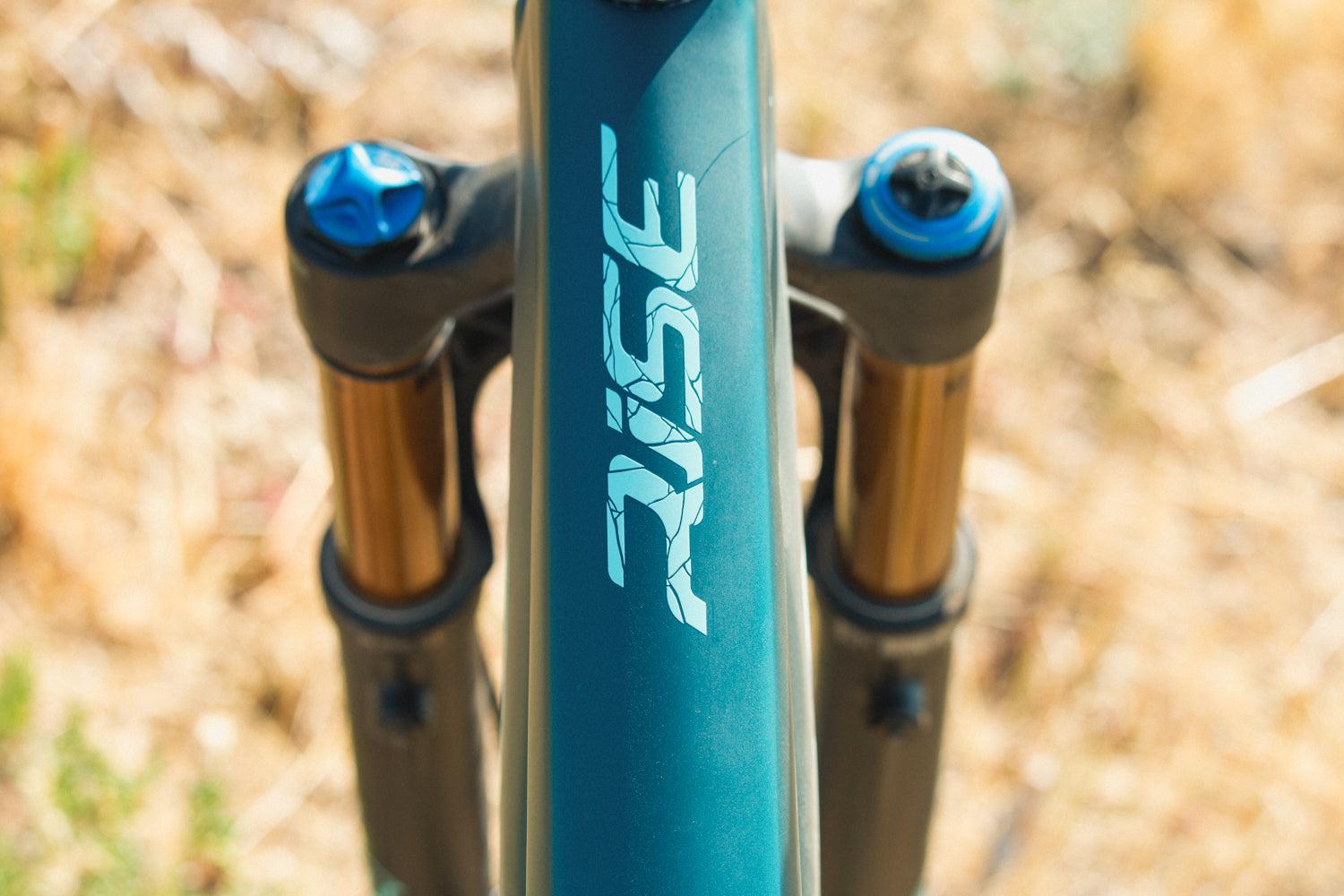 The Top tube of an Orbea Rise E-Mountain bike with Blue paint. 