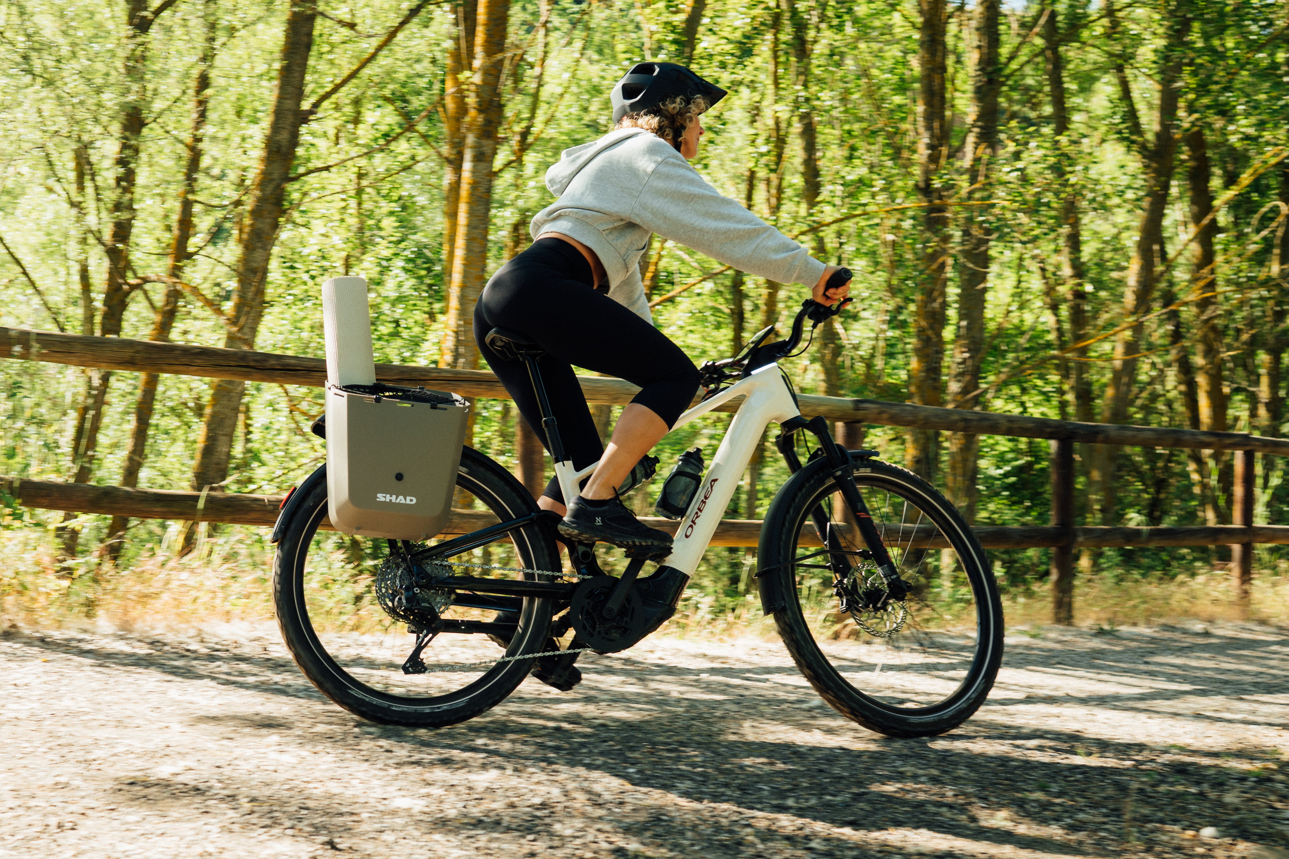 The Orbea Muga being ridden by a woman in a forest