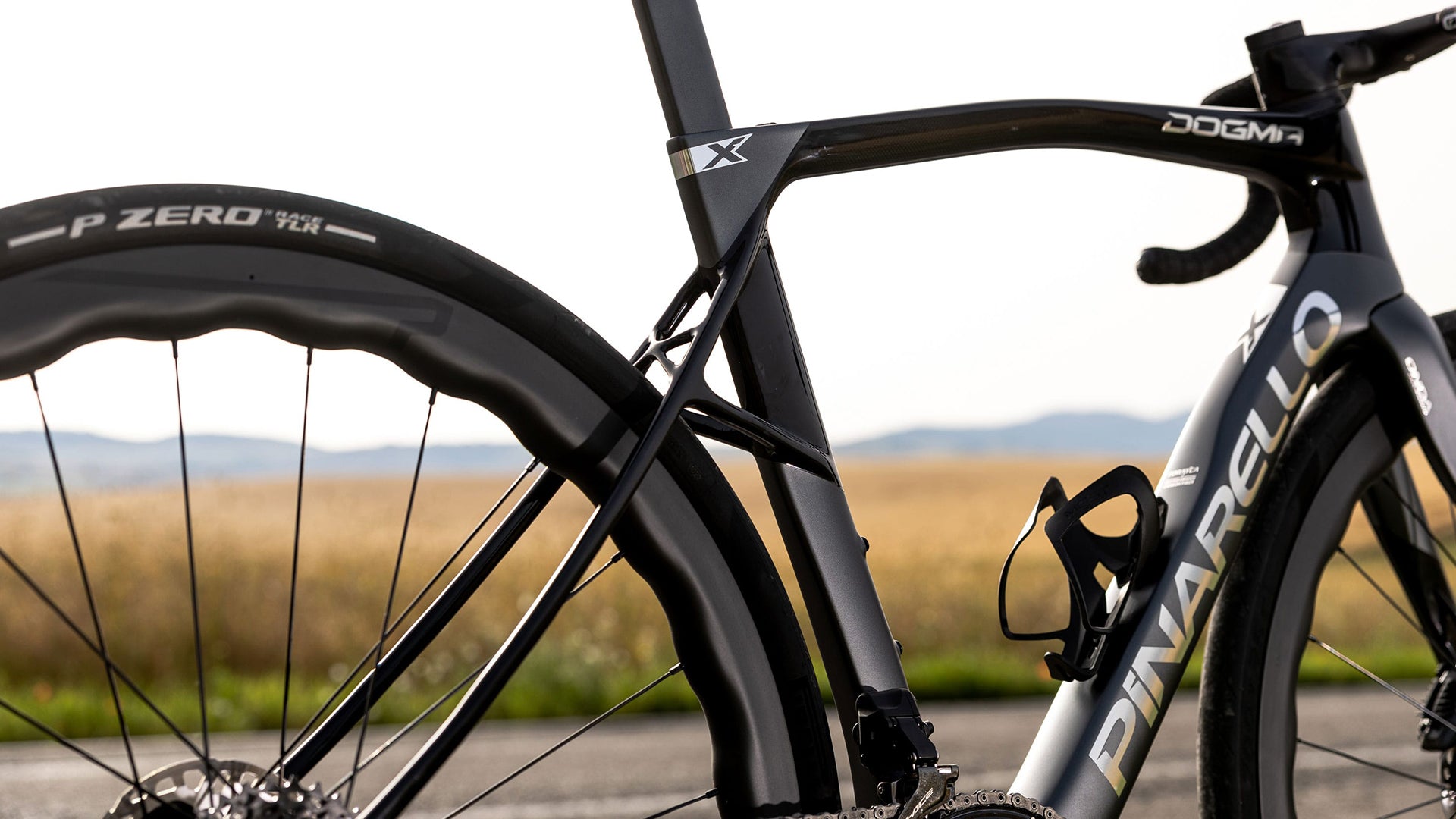 A detailed shot of the Pinarello dogma X road bike in black