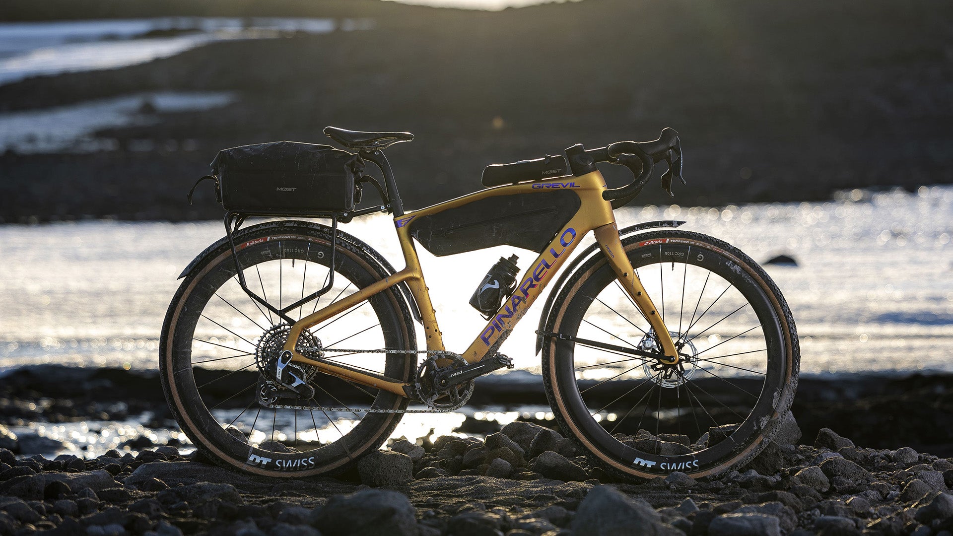 A detailed shot of the Pinarello Grevil F Gravel bike against an ocean. 
