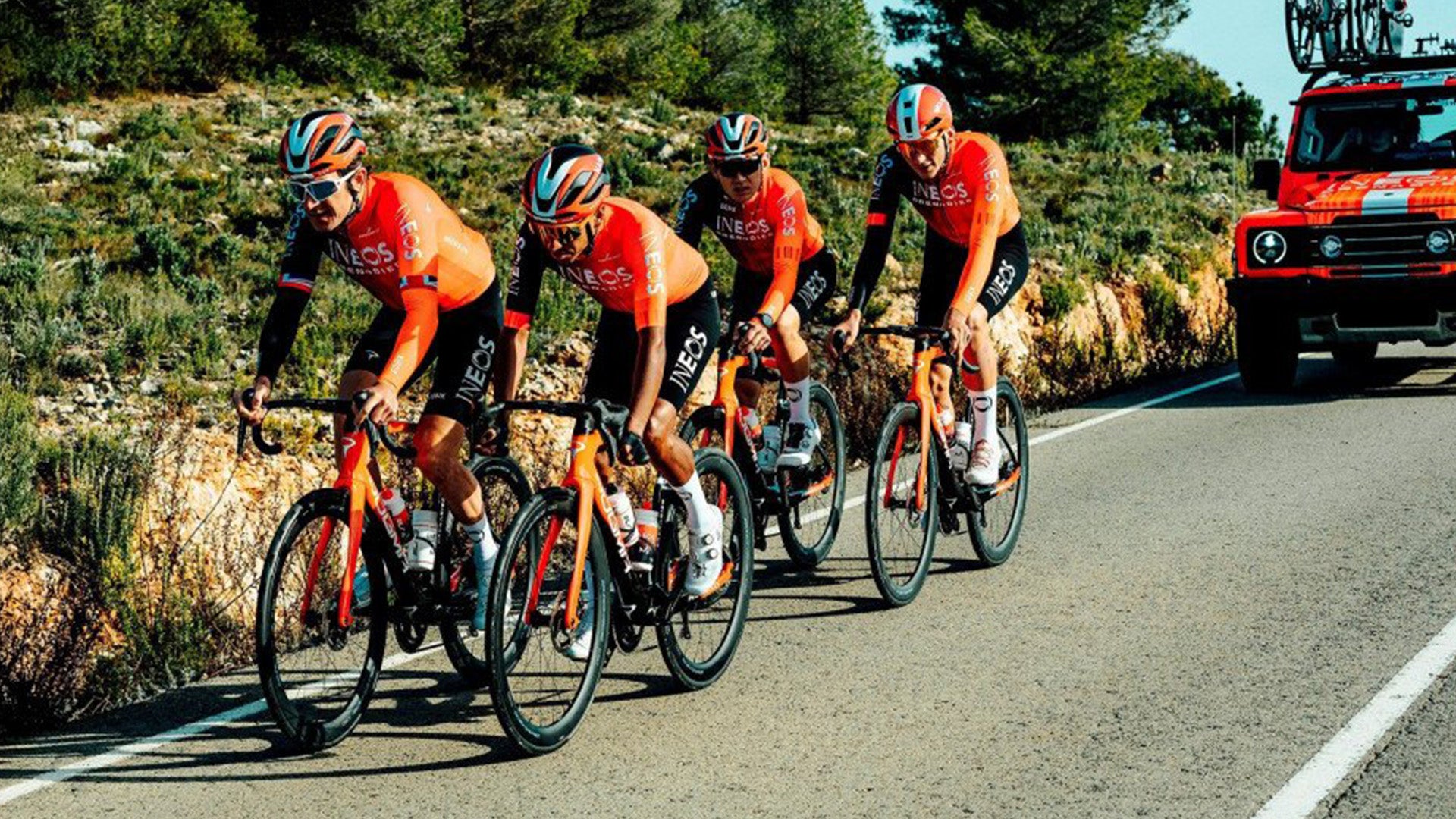 a group of people riding pinarello road bikes