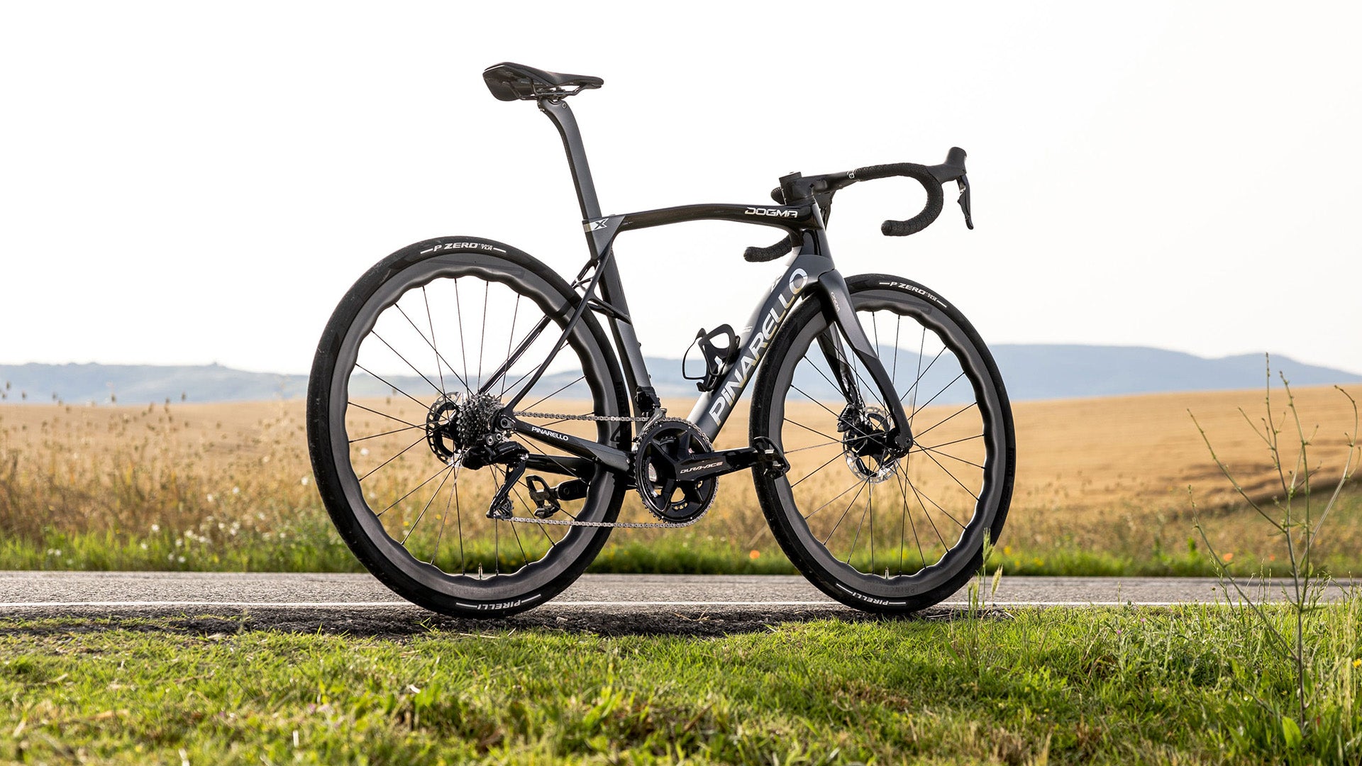 The Pinarello Dogma X road bike against a field background