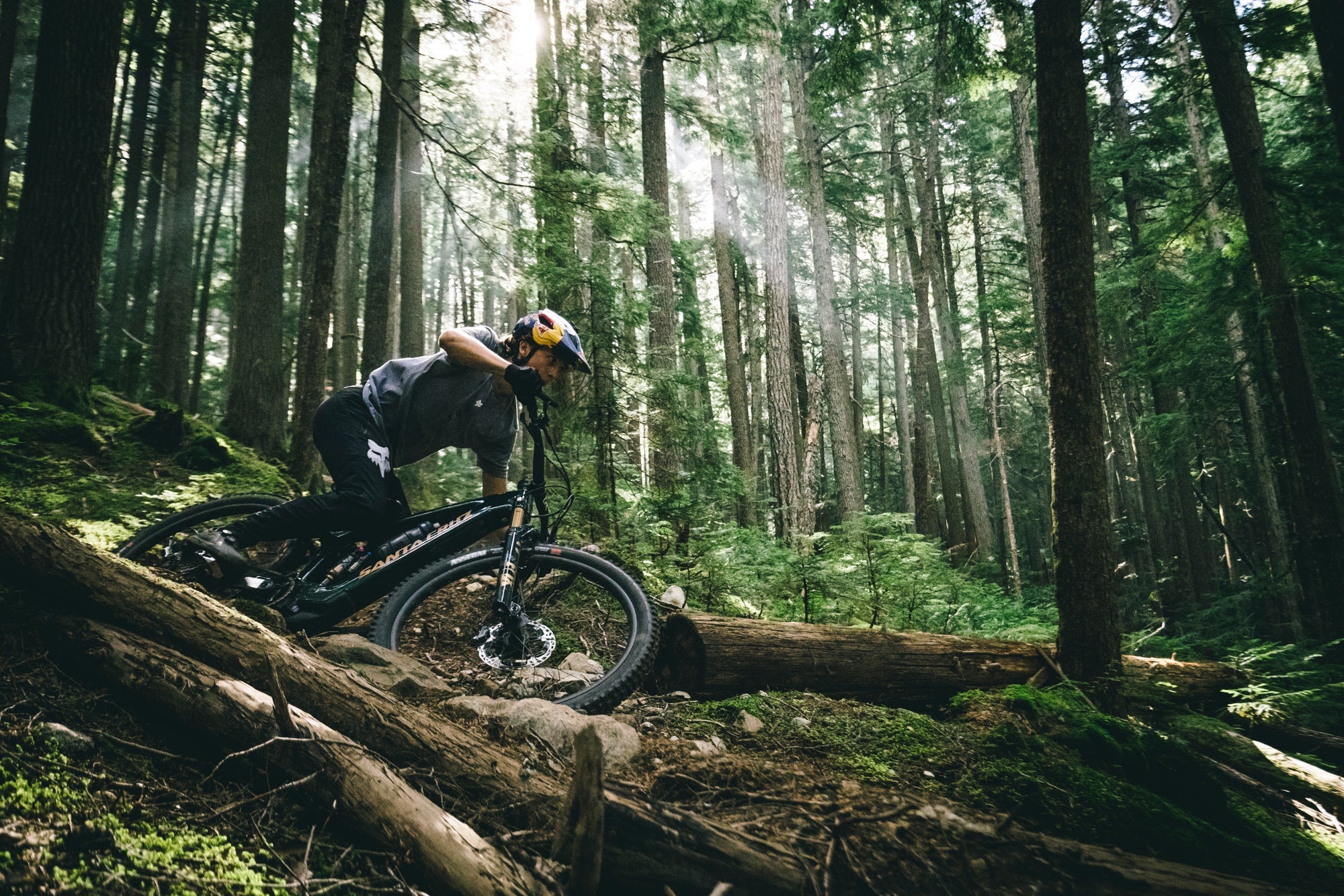 A person riding the Santa Cruz Vala through a forest