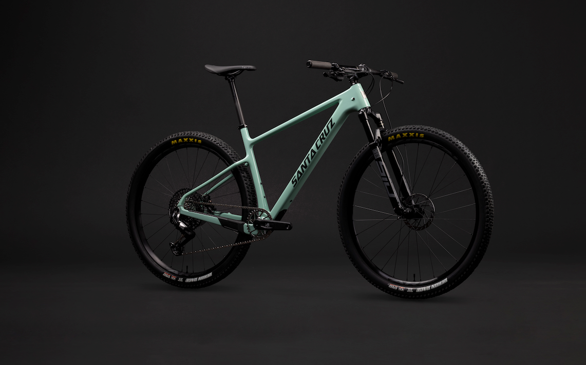 The Santa Cruz Highball XC bike in green on a black background.