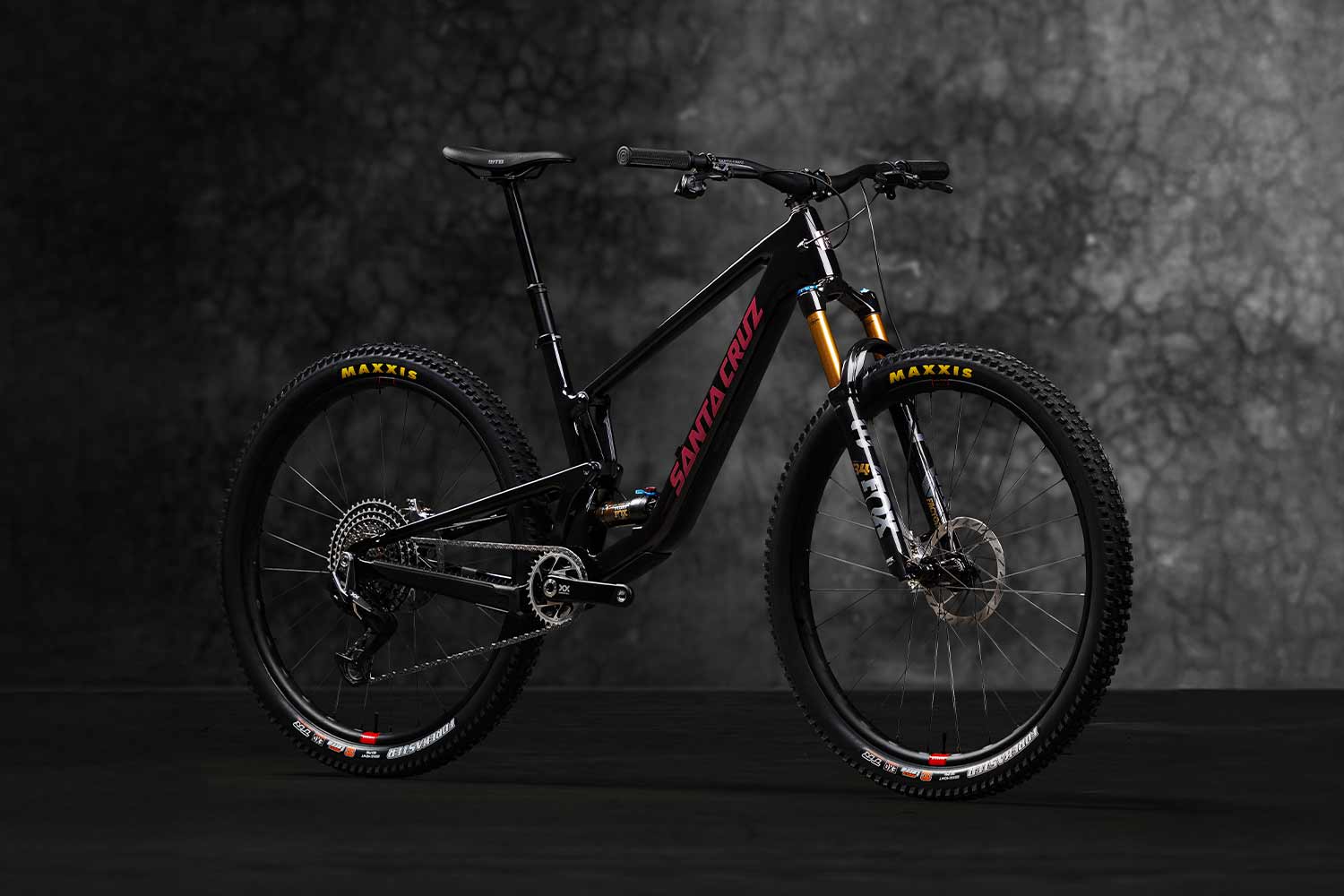 Black Santa Cruz Tallboy in front of grey background.