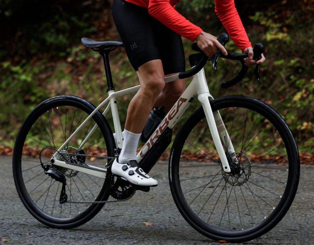 A picture of the Orbea Avant Road bike, being ridden by a man. 