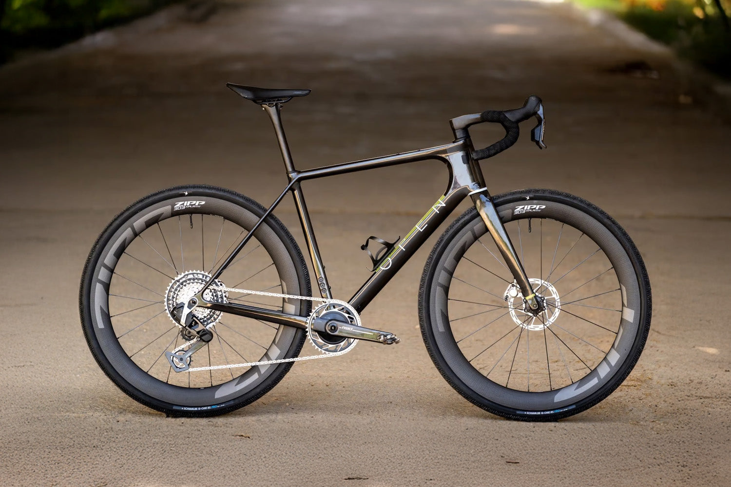 Carbon fiber bicycle on a blurred road background