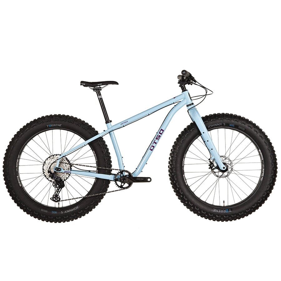 A light blue Otso Arctodus SLX fat bike with purple lettering and very large tires